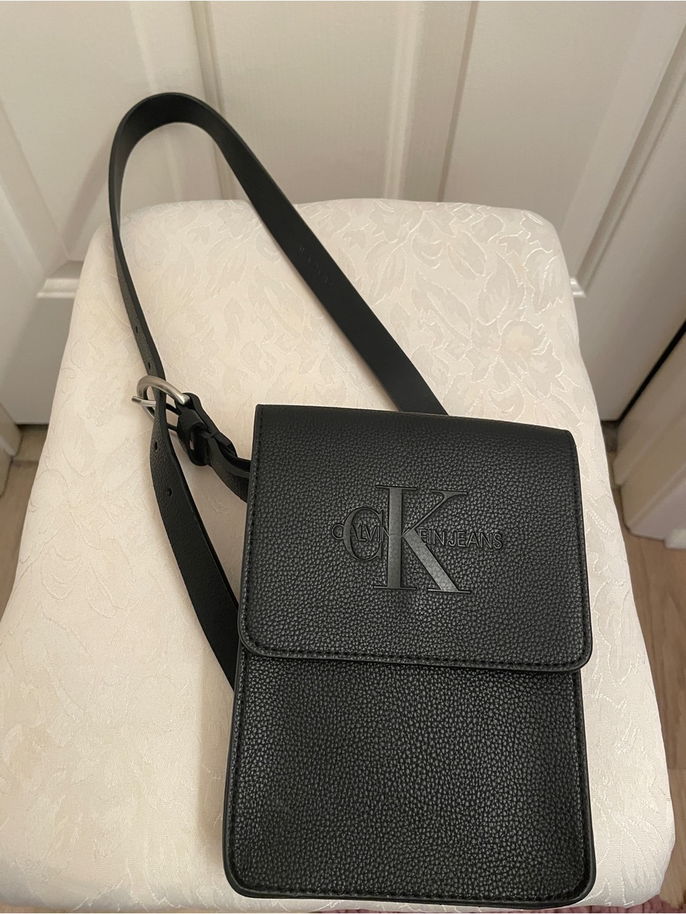 Calvin Klein Black Pebbled Leather Crossbody Pouch with Embossed CK